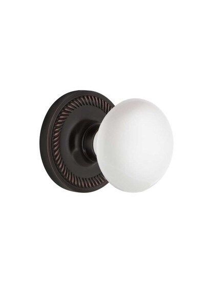 Rope Rosette Mortise Lock Set With White Porcelain Door Knobs in Timeless Bronze.
